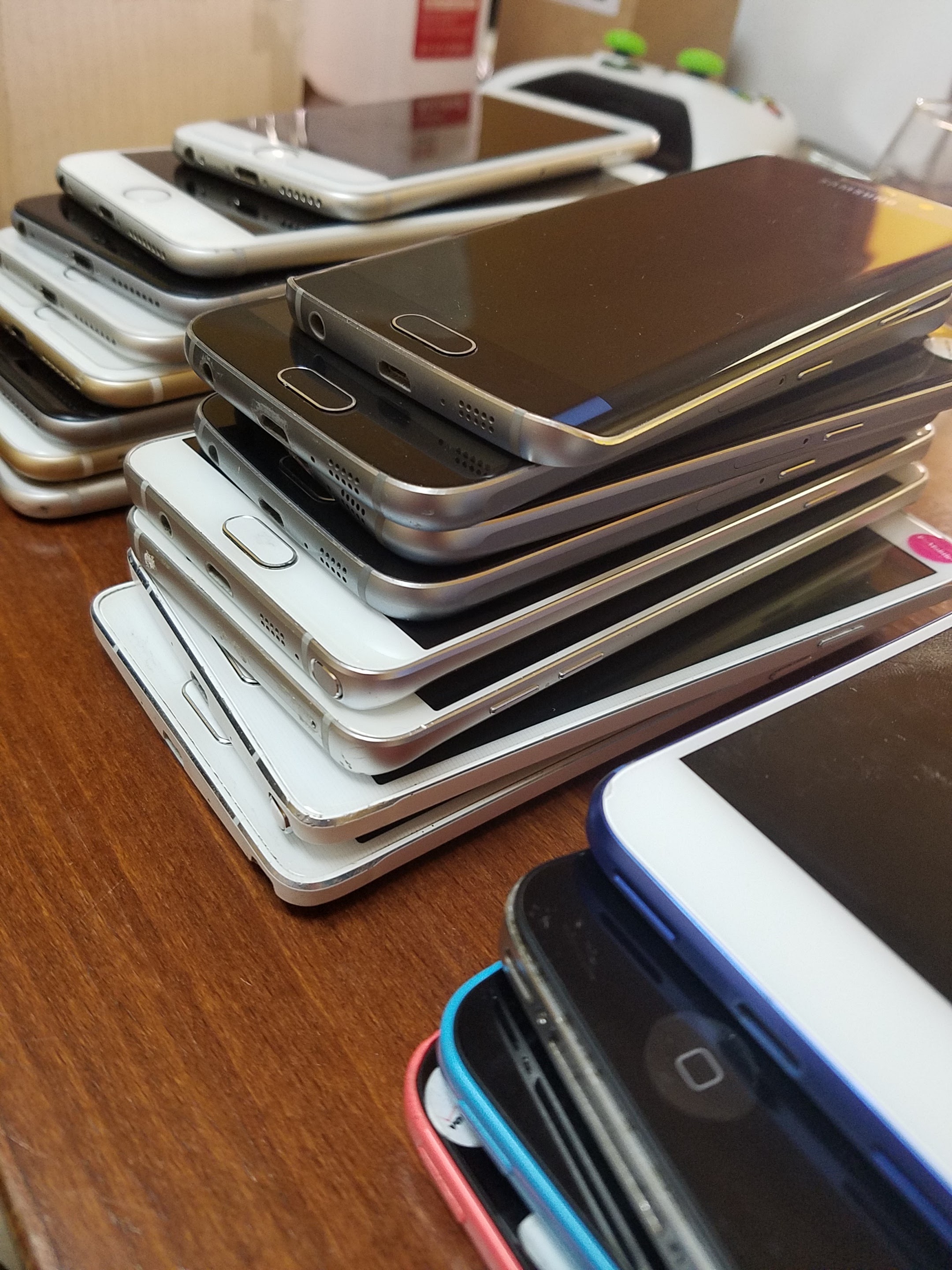 TDR phone repair expert working on a device